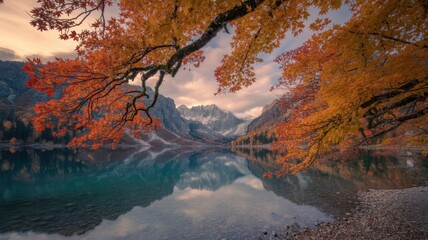 Scenic autumn landscape reflecting in the tranquil waters of lake hinterer gosausee, austria, with vibrant foliage framing the majestic mountains