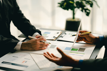 Various colleagues work together in a conference room. Brainstorming, discussion, analysis, and business strategic planning..teamwork concept