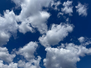 Puffy clouds in blue sky.