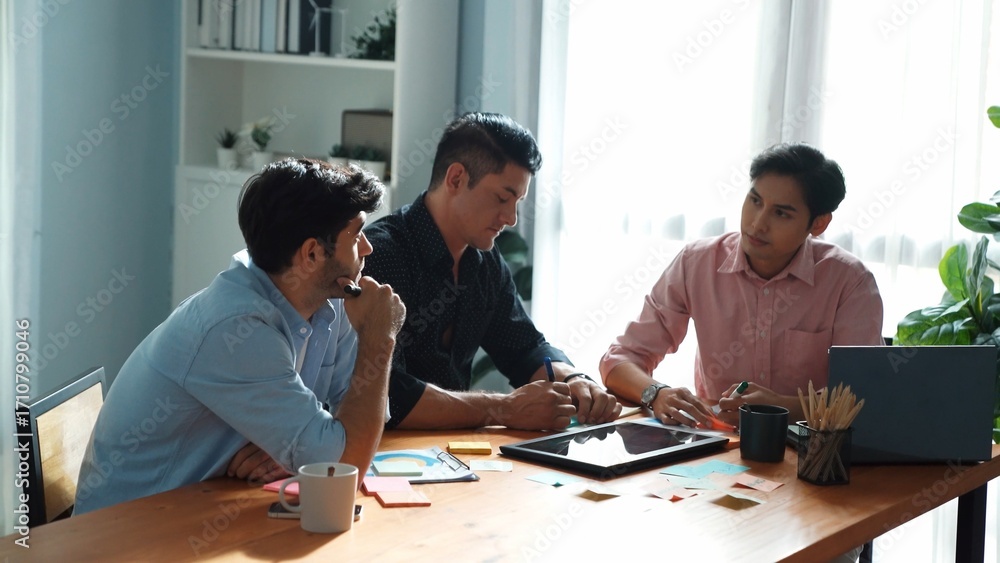 Poster Group of diverse people sharing idea while writing at sticky notes. Professional smart business team brainstorming idea and planning strategy for startup project while wear casual outfit. Convocation.