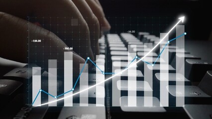 A close-up image featuring hands typing on a computer keyboard while digital graphs and charts...