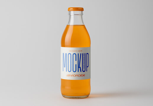 Clear Glass Bottle with Orange Soda Lemonade Packaging Label Mockup