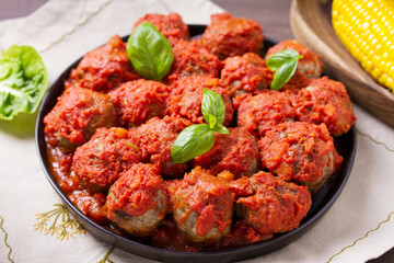 Juicy pan seared beef meatballs with tomato sauce