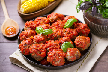Juicy pan seared beef meatballs with tomato sauce