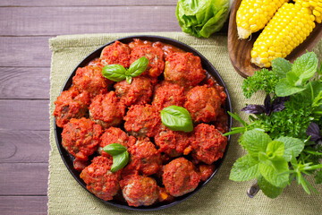 Juicy pan seared beef meatballs with tomato sauce. View from above, top studio shot