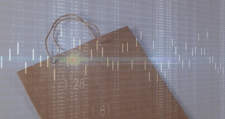 Fototapeta premium Displaying kraft paper bag with rope handles on studio table with candlestick chart overlay