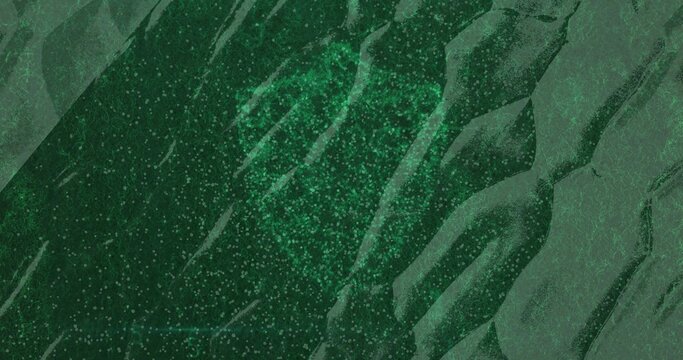 Fototapeta Showing dark green textured fabric folding diagonally in close up, with green glitter speckles