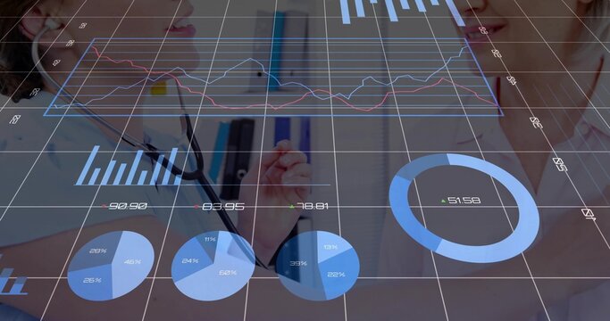 Demonstrating stethoscope use senior doctor mentoring junior doctor in office, with digital charts