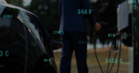 Navy-suited man plugging charger cable into EV port at parking lot, currency overlays, copy space