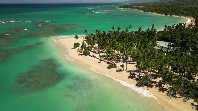 4K drone footage of Punta Popy Beach &mdash; postcard-perfect blue sea, sand, and palms. Best for tourism boards and destination marketing