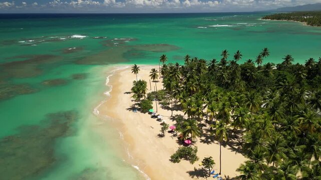 Aerial 4K view of Punta Popy Beach &mdash; pristine turquoise waters and sandy shore. Ideal for real estate and luxury travel ads