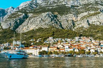 Amazing beach with boats on  azure sea in Makarska, Dalmatia region of Croatia.