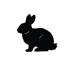 A dark rabbit form sits peacefully captured as a striking silhouette