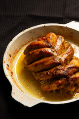 Juicy roasted chicken breast in aromatic herb sauce perfect for Christmas or Thanksgiving feast