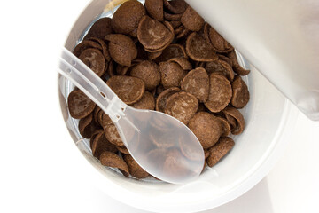 A bowl of chocolate cereal isolated on white background. Delicious nutritious Breakfast for the child