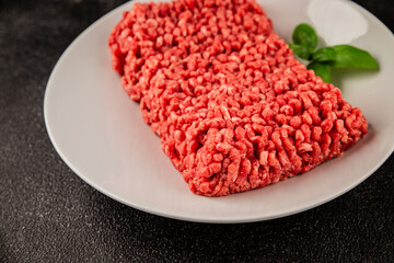 Raw minced meat beef pork ground meat natural product tasty snack fresh delicious gourmet food background on the table rustic top view copy space