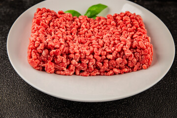 Raw minced meat beef pork ground meat natural product tasty snack fresh delicious gourmet food background on the table rustic top view copy space
