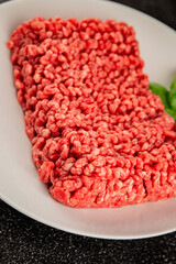 Raw minced meat beef pork ground meat natural product tasty snack fresh delicious gourmet food background on the table rustic top view copy space