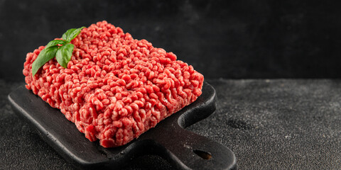 Raw minced meat beef pork ground meat natural product tasty snack fresh delicious gourmet food background on the table rustic top view copy space