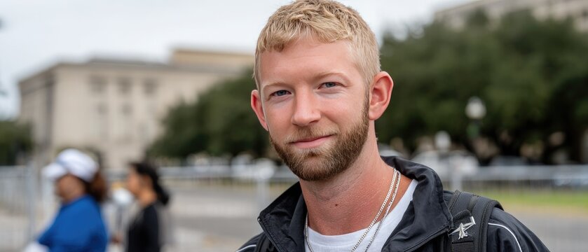 Yellow excavator works on construction site under a bright blue sky with clouds, showcasing the machinery's vibrant details and activity
