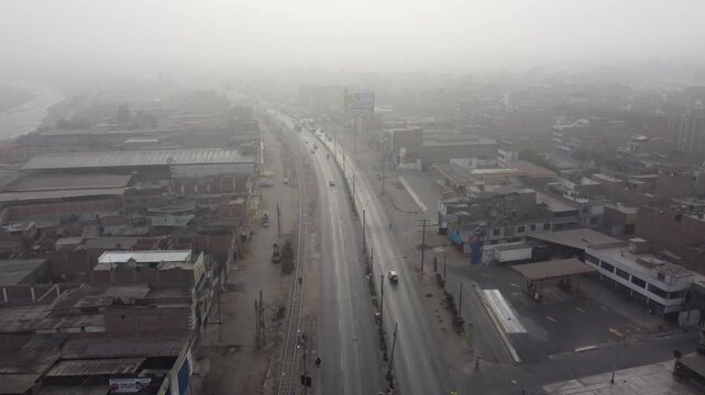 Aerial view of foggy lima peru highway traffic