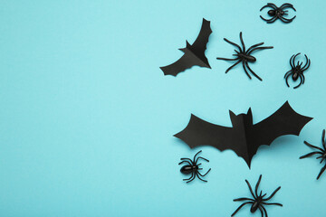 Halloween background with spiders as symbols of Halloween on the blue background. Happy Halloween concept