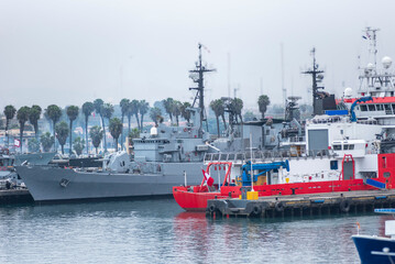 Gray navy warship moored in the port of Callao, Peru.