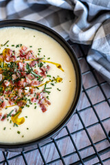 Homemade recipe for white vegetable cream soup with ham