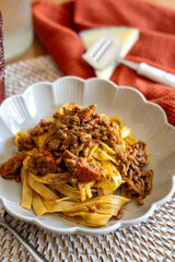 homemade recipe for pasta with Bolognese sauce and cheese