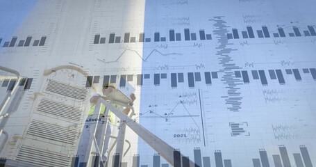 technician climbing wind turbine stairs reaching platform opening laptop reviewing overlaid charts - Powered by Adobe