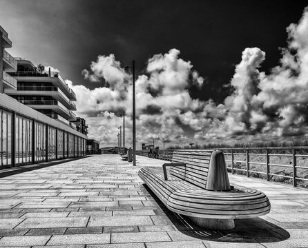 Modern Boardwalk Under Dramatic Skies at Kijkduin Beach in The Hague