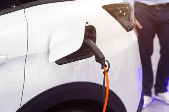 Fototapeta Close-up of a electric car charging at a public charging station