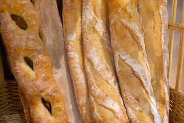 The baguettes is arranged on shelves and is ready to be sold