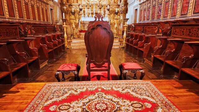 Vaulted nave of Interior of Igreja de Nossa Senhora da Oliveira Church houses baroque retables carved choir stalls in Guimaraes, Portugal