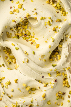Pistachio gelato with crushed nuts closeup