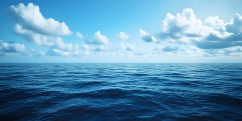 Obraz premium A picturesque view of a vast blue ocean under a clear sky with fluffy white clouds, showcasing serene water and gentle waves.