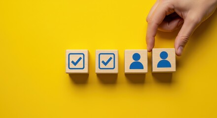 Choosing the right candidate, a hand selecting one person from a selection of four wooden blocks