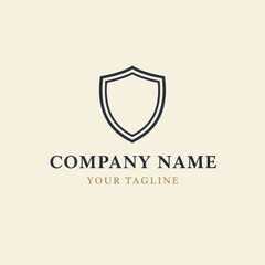 Elegant logo design featuring a double-lined shield emblem.