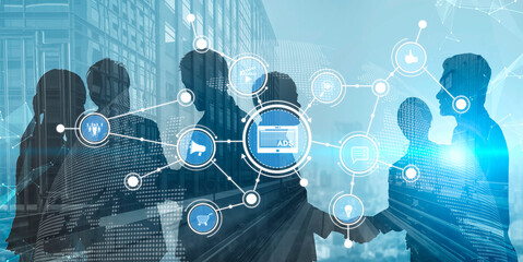 Silhouettes of business professionals engage in a strategic discussion on digital marketing...