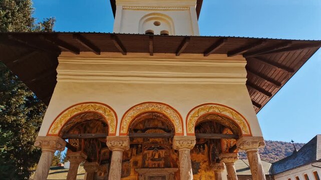 Exquisite painted interior of the Sinaia Orthodox Monastery, Sinaia, Transylvania, Romania, captures wall to wall murals, patterned borders, and careful iconography
