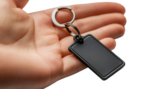Black Rectangular Keychain with Metal Ring Held in a Human Hand, Isolated on a Clear Background for Design