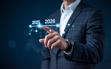 Obraz premium A businessman touches a digital progress bar indicating the transition from 2025 to 2026, goal achievement planning, symbolizing strategic planning, future readiness and challenge strategy.