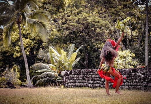 Ori Tahiti Vahine dancing in front of sacred tahitian Marae