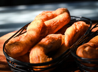 Close up of a basket of Firi Firi (tahitian donuts) 