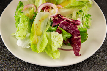 Chicory salad green leaf mix vegetables dish natural product tasty snack fresh delicious gourmet food background on the table rustic top view copy space keto and paleo diet vegan and vegan food