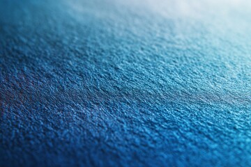 Textured blue denim jeans fabric with a detailed, macro pattern on a canvas surface