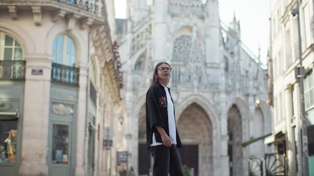 Woman tourist walking through the beautiful French city of Rouen. Architecture historical buildings travel and tourism Europe.
