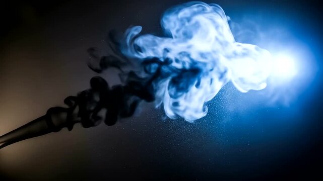 Dramatic interplay of vibrant blue and dark smoke against a dark background.