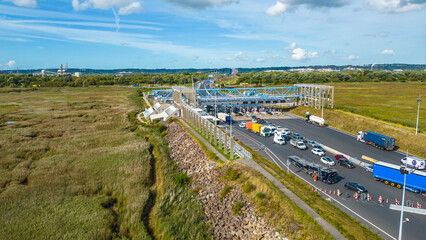 Aerial view of Pont de Normandie, the iconic cable-stayed bridge spanning the Seine River in Normandy, France, connecting Le Havre and Honfleur, surrounded by scenic landscape and waterways