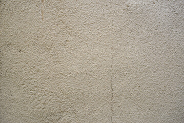 The wall with a crack was plastered over and then cracked again.